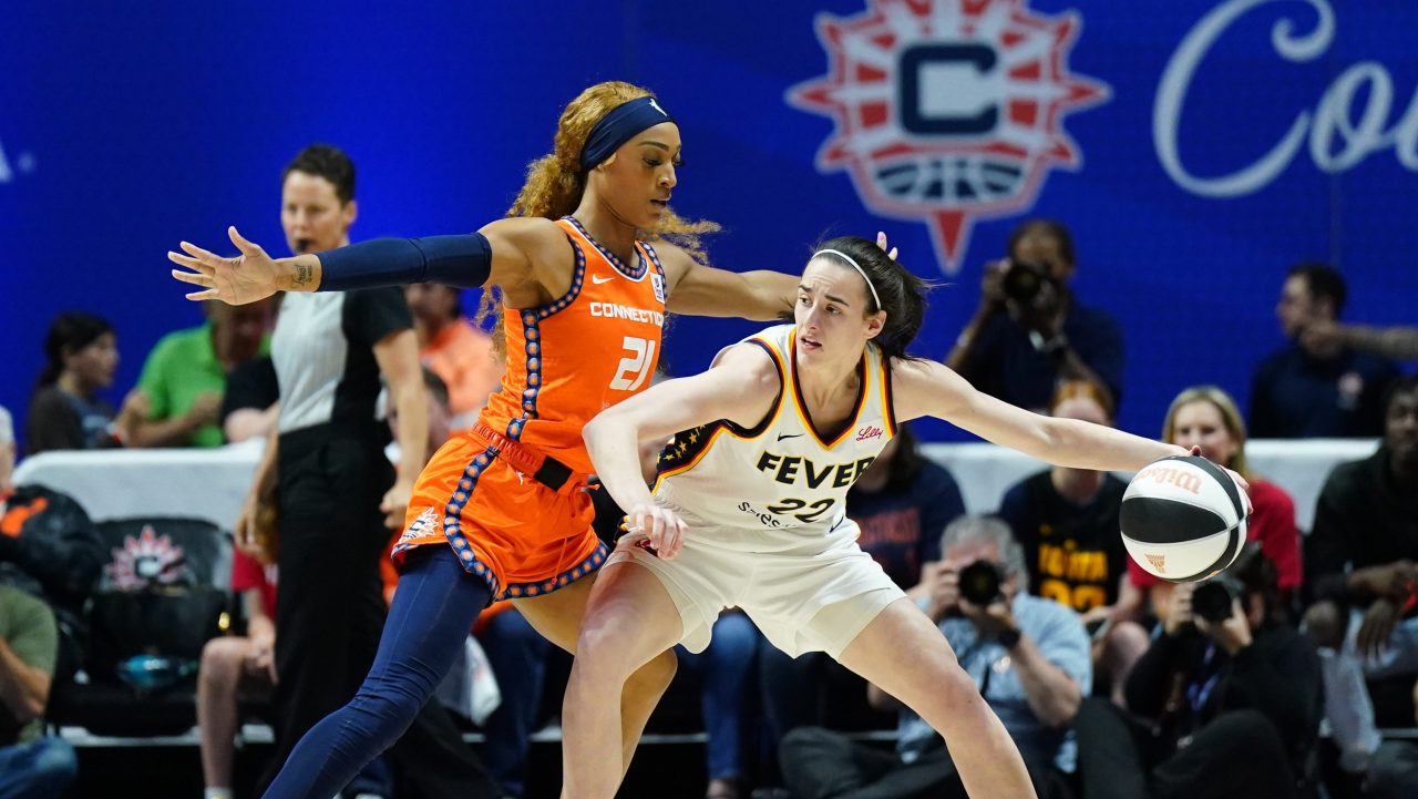 The Sun's DiJonai Carrington defends Fever guard Caitlin Clark